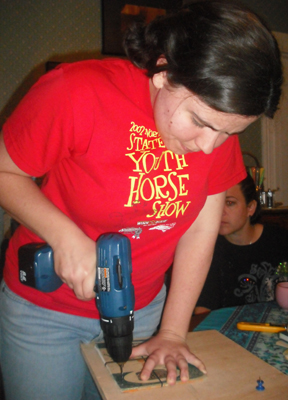 A girl with a drill: it's a beautiful thing.