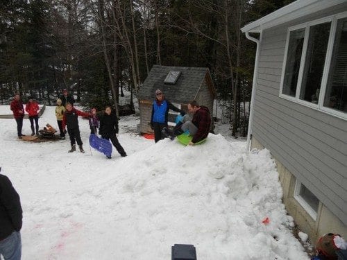 My fiance Derrick hitting the luge he's been piling snow for for months.